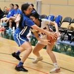 Klawocks Jayla Edenshaw (11) is fouled by Davis Ramoths Brooklyn Hingsbergen during the Chieftains 46-32 loss to the Wolves on Friday in the 2025 ASAA March Madness Alaska 1A State Basketball Championships at Anchorages Alaska Airlines Center (Klas Stolpe / Juneau Empire)
