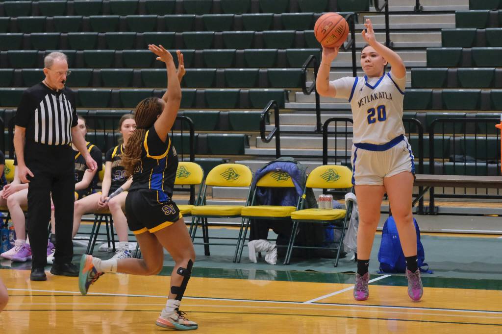 Metlakatla junior Morgan Hayward (20) shoots over Susitna Valley senior Sahai Benischek during their 4th/6th-place game against Susitna Valley Saturday at the 2025 ASAA March Madness Alaska 2A State Basketball Championships at UAAs Avis Sports Center. (Klas Stolpe / Juneau Empire)