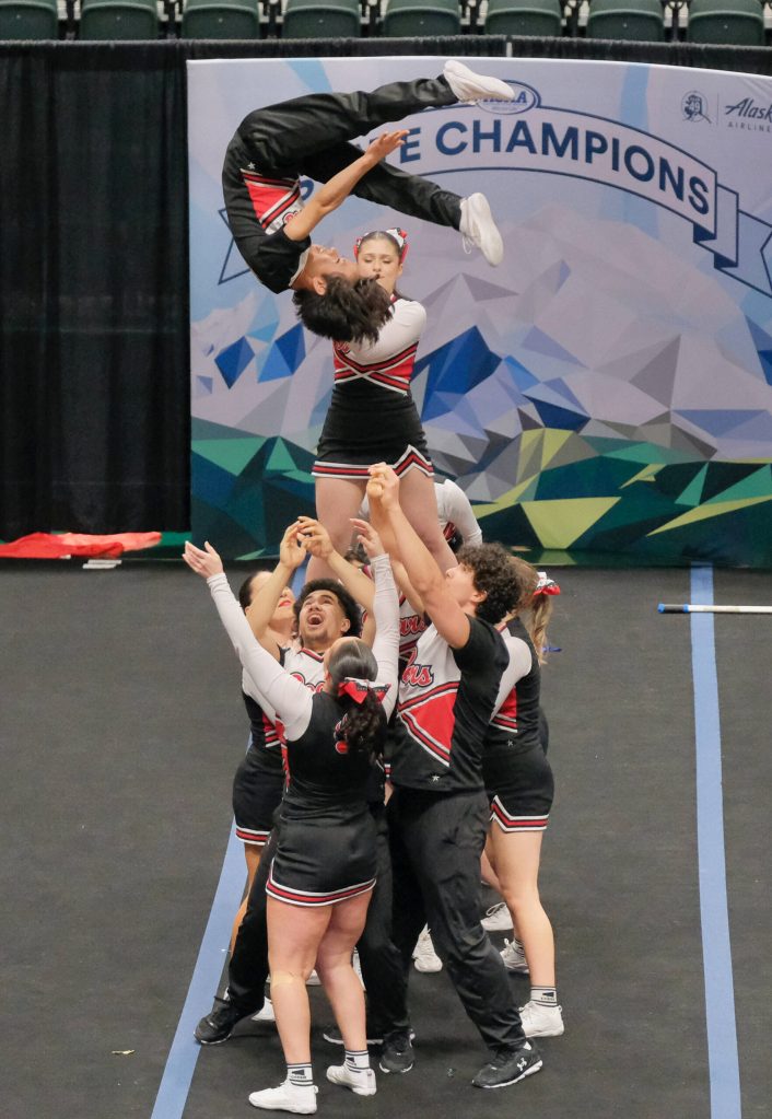 The Juneau-Douglas High School: Yadaa.at Kalé Crimson Bears cheer team perform during the Division I 2025 ASAA Cheer State Championships Tuesday at Anchorages Alaska Airlines Center. (Klas Stolpe / Juneau Empire)