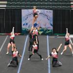 The Juneau-Douglas High School: Yadaa.at Kalé Crimson Bears cheer team perform during the Division I 2025 ASAA Cheer State Championships Tuesday at Anchorages Alaska Airlines Center. (Klas Stolpe / Juneau Empire)