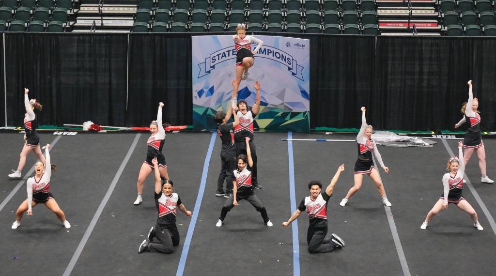 The Juneau-Douglas High School: Yadaa.at Kalé Crimson Bears cheer team perform during the Division I 2025 ASAA Cheer State Championships Tuesday at Anchorages Alaska Airlines Center. (Klas Stolpe / Juneau Empire)