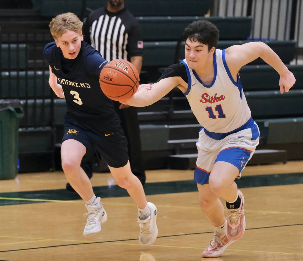 Sitka junior Kai Hirai (11) steals a ball from Homer senior Spencer Dye (3) during the Wolves 61-24 win over the Mariners on Wednesday at the 2025 ASAA March Madness Alaska 3A/4A Basketball State Championships at Anchorages Alaska Airlines Center. (Klas Stolpe / Juneau Empire)