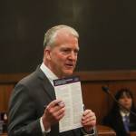 U.S. Sen. Dan Sullivan (R-Alaska) holds up President Donald Trumps executive order Unleashing Alaskas Extraordinary Resource Potential during his annual address to the Alaska Legislature on March 20, 2025. (Jasz Garrett / Juneau Empire)