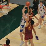 Mt. Edgecumbes Xavier Gundersen (24) blocks a shot by Sitkas Trey Johnson (24) during the Braves 64-62 semifinal loss to the Wolves on Thursday in the 2025 ASAA March Madness Alaska 3A/4A Basketball State Championships at Anchorages Alaska Airlines Center. (Klas Stolpe / Juneau Empire)