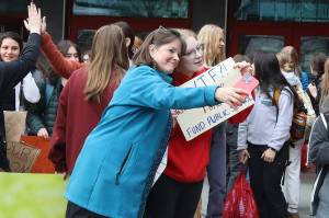 Rep. Alyse Galvin, an Anchorage independent, takes a photo with Meadow Stanley, a senior at Juneau-Douglas High School: Yadaa.at Kalé on April 4, 2024, before they took part in a march protesting education funding from the school to the Alaska State Capitol. (Mark Sabbatini / Juneau Empire file photo)