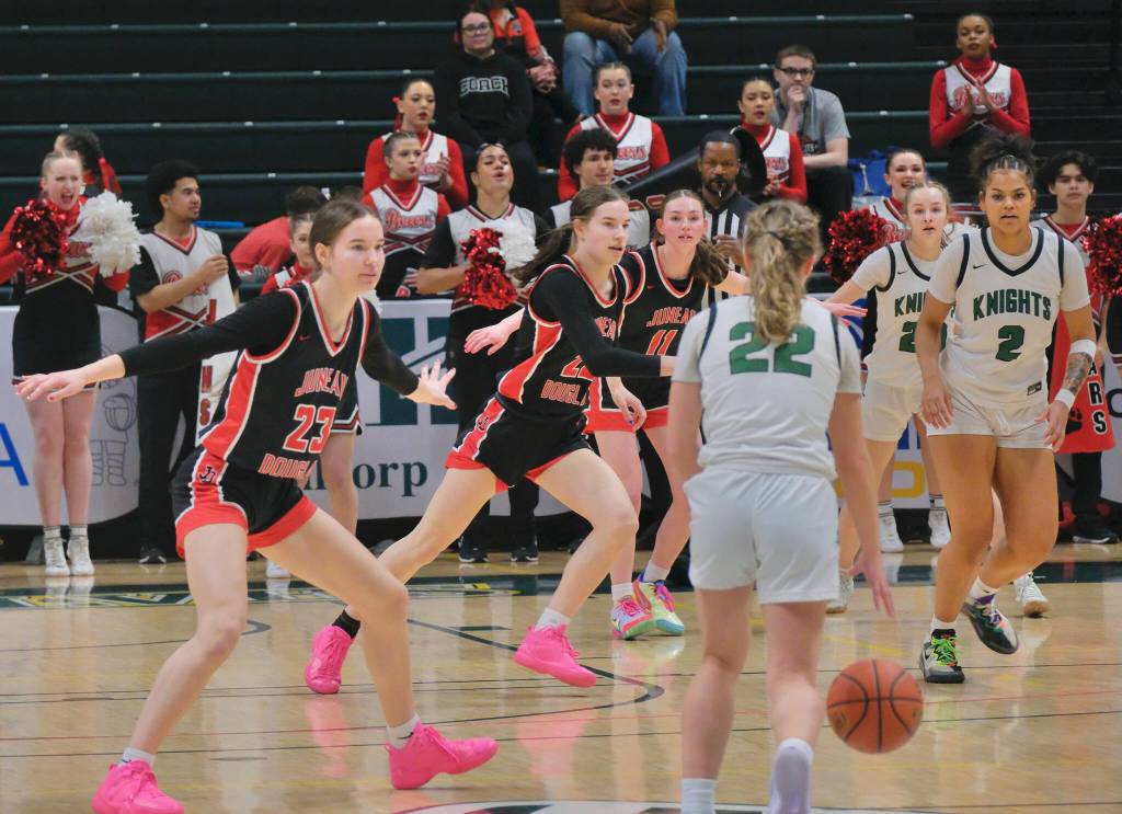 Juneau-Douglas High School: Yadaa.at Kalé senior Cailynn Baxter (23), senior Kerra Baxter (22) and junior Gwen Nizich (11) defend Colony senior Hallie Clark (22), senior Ashlyn Waggoner (2) and sophomore Annelise Larsen (20) during the Crimson Bears 56-34 loss to the Knights in a Friday 4A girls semifinal at the 2025 ASAA March Madness Alaska 3A/4A Basketball State Championships at Anchorages Alaska Airlines Center. (Klas Stolpe / Juneau Empire)