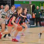 Juneau-Douglas High School: Yadaa.at Kalé sophomore Bergen Erickson, sophomore June Troxel (5) and senior Mary Johnson (4) run a fast break during the Crimson Bears 56-34 loss to the Colony Knights in a Friday 4A girls semifinal at the 2025 ASAA March Madness Alaska 3A/4A Basketball State Championships at Anchorages Alaska Airlines Center. (Klas Stolpe / Juneau Empire)