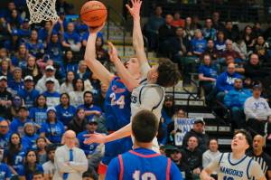Sitka junior Trey Johnson scores past Nome sophomore Stanley Booth during the Wolves 62-43 loss to the Nanooks on Saturday in the 3A championship game of the 2025 ASAA March Madness Alaska 3A Basketball State Championships in Anchorages Alaska Airlines Center. (Klas Stolpe / Juneau Empire)