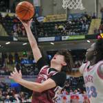 Ketchikan senior Jonathan Scoblic shoots under pressure from East Anchorage senior Muhammed Sabally (23) during the Kings 43-25 loss to the Thunderbirds on Saturday in the 4A championship game of the 2025 ASAA March Madness Alaska 4A Basketball State Championships in Anchorages Alaska Airlines Center. (Klas Stolpe / Juneau Empire)