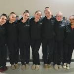 Juneau-Douglas High School: Yadaa.at Kalé dance team seniors, left-to-right, Officer Shae (Shalynn) Lee, Stella Moran, Captain Bella (Isabella) Cadigan McAdoo, Officer Serena Crup, 1st Lieutenant Reonna Maloney, 1st Lieutenant Bristol Casperson, Officer Haylee Baxter, Officer Aya (Amelia) Yadao and Laura Gibb pose for a photo Thursday at the 2025 ASAA March Madness Alaska 3A/4A Basketball State Championships in Anchorages Alaska Airlines Center. (Klas Stolpe / Juneau Empire)
