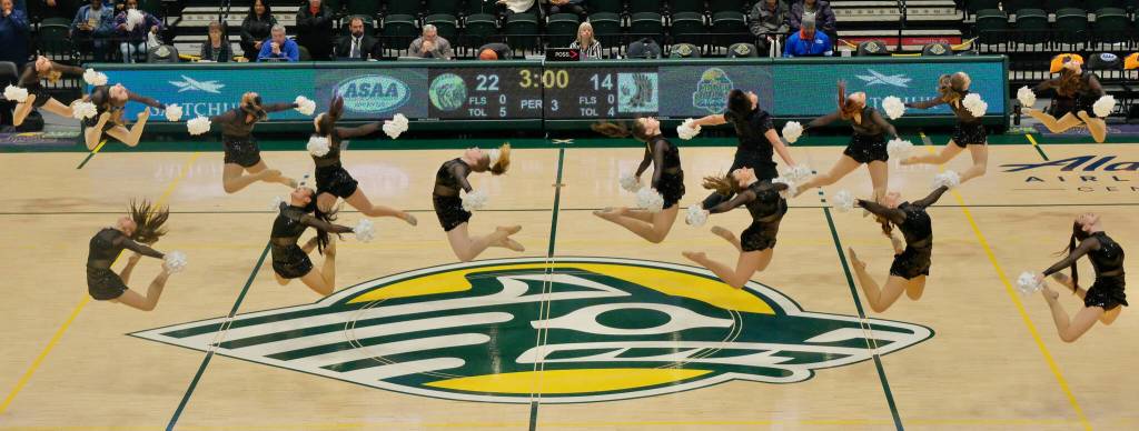 The Juneau-Douglas High School: Yadaa.at Kalé dance team performs their Pom routine Friday at the 2025 ASAA March Madness Alaska 3A/4A Basketball State Championships in Anchorages Alaska Airlines Center. (Klas Stolpe / Juneau Empire)