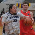Klawocks Deion Jackson (13) fouls Hunas Orion Dybdahl during B Bracket action Sunday at the 76th Annual Juneau Lions Club Gold Medal Basketball Tournament in Juneau-Douglas High School: Yadaa.at Kalés George Houston Gymnasium. (Klas Stolpe / Juneau Empire)