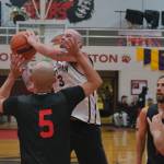 Klukwans Jacob Hotch (3) shoots over Hydaburgs Devin Edenshaw (5) during C Bracket action Monday at the 76th Annual Juneau Lions Club Gold Medal Basketball Tournament in Juneau-Douglas High School: Yadaa.at Kalés George Houston Gymnasium. (Klas Stolpe / Juneau Empire)