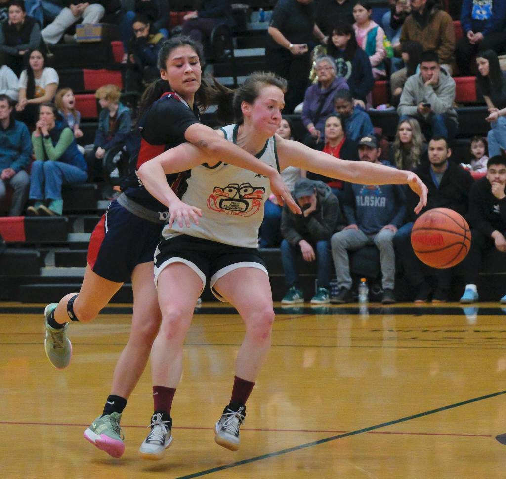 Yakutats Trinity Jackson tries to steal the ball from Craigs Nani Weimer during Craigs 53-41 Womens Bracket win Monday at the 76th Annual Juneau Lions Club Gold Medal Basketball Tournament in Juneau-Douglas High School: Yadaa.at Kalés George Houston Gymnasium. (Klas Stolpe / Juneau Empire)