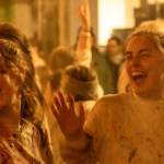 Bella Sanders and Tatum Hartlieb laugh after the throwing of colors on Monday, March 24, 2025. (Jasz Garrett / Juneau Empire)