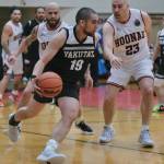 Yakutats Alan Vale (19) dribbles against Hoonahs Tavis Dybdahl (23) during Hoonahs 75-43 C Bracket elimination game win Tuesday at the 76th Annual Juneau Lions Club Gold Medal Basketball Tournament in Juneau-Douglas High School: Yadaa.at Kalés George Houston Gymnasium. (Klas Stolpe / Juneau Empire)