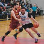 Mt. Edgecumbes Zack Kline defends Juneau AMLs Mahina Toutaiolepo (24) during Juneaus 91-67 A Bracket win Tuesday at the 76th Annual Juneau Lions Club Gold Medal Basketball Tournament in Juneau-Douglas High School: Yadaa.at Kalés George Houston Gymnasium. (Klas Stolpe / Juneau Empire)