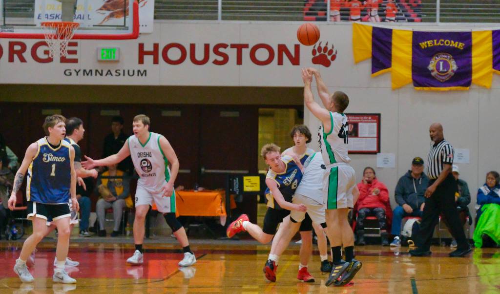 Haines Kyle Fossman (42) hits a shot passed the arc over Ketchikans Clayton Olmstead (2) during Haines 91-51 B Bracket elimination game win Wednesday at the 76th Annual Juneau Lions Club Gold Medal Basketball Tournament in Juneau-Douglas High School: Yadaa.at Kalés George Houston Gymnasium. (Klas Stolpe / Juneau Empire)
