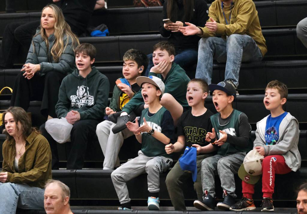 Young fans cheer for Klukwan during a Masters Bracket elimination game against Hoonah on Wednesday at the 76th Annual Juneau Lions Club Gold Medal Basketball Tournament in Juneau-Douglas High School: Yadaa.at Kalés George Houston Gymnasium. (Klas Stolpe / Juneau Empire)