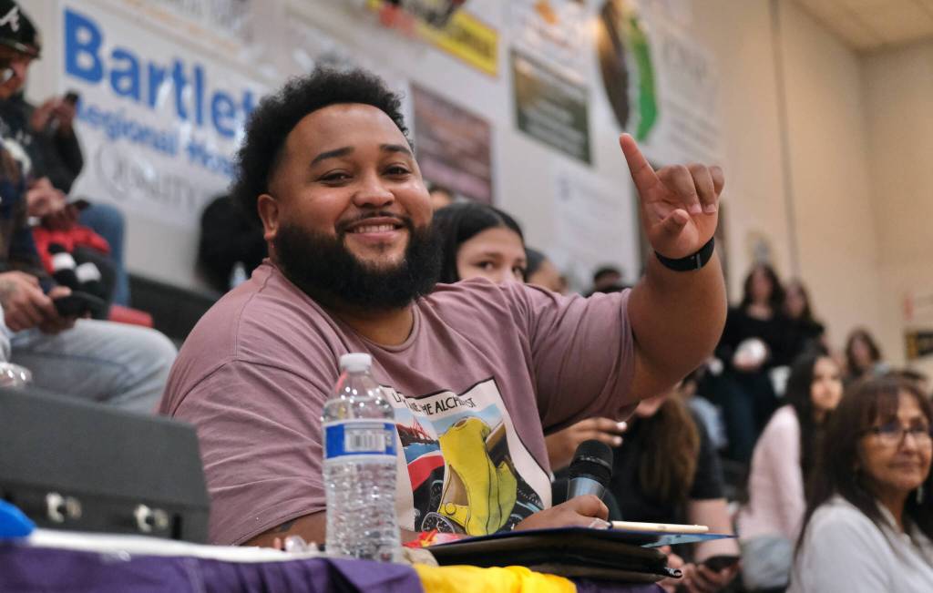 Gold Medal game announcer Anthony Ziegler entertains the crowd with game scoring, announcements and witty banter Wednesday during action at the 76th Annual Juneau Lions Club Gold Medal Basketball Tournament in Juneau-Douglas High School: Yadaa.at Kalés George Houston Gymnasium. (Klas Stolpe / Juneau Empire)