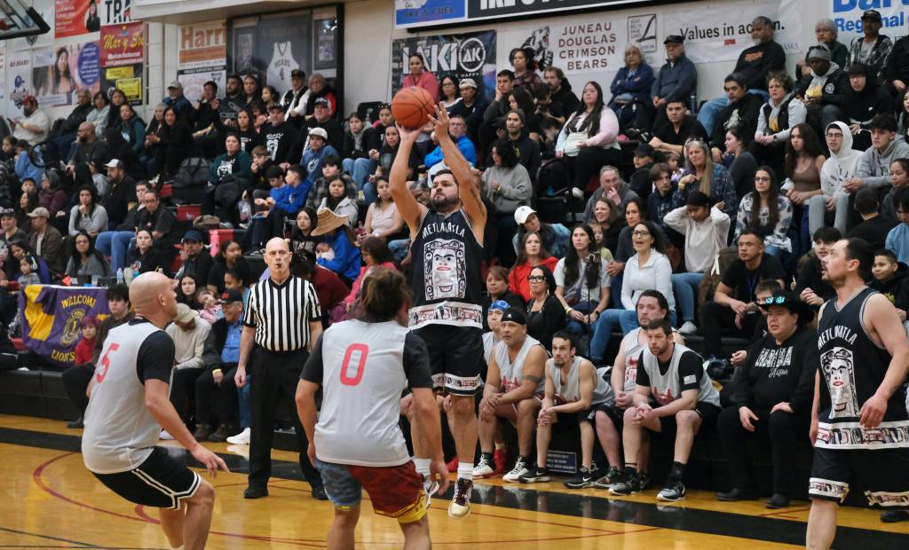 A Metlakatla player shoots against Hydaburg during Metlakatlas 74-65 C Bracket semifinal win Thursday at the 76th Annual Juneau Lions Club Gold Medal Basketball Tournament in Juneau-Douglas High School: Yadaa.at Kalés George Houston Gymnasium. (Klas Stolpe / Juneau Empire)