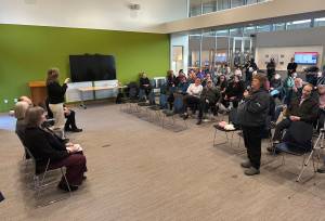 Lesley Thompson asks a question during a town hall with the three members of Juneaus state legislative delegation Thursday night at the Mendenhall Valley Public Library. (Mark Sabbatini / Juneau Empire)