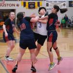 Hooper Bays Susie Long (3) is fouled by Yakutats Nadine Fraker (10) and Trinity Jakcson (12) Friday during Hooper Bays 60-58 Womens Bracket elimination game win over Yakutat at the 76th Annual Juneau Lions Club Gold Medal Basketball Tournament in Juneau-Douglas High School: Yadaa.at Kalés George Houston Gymnasium. (Klas Stolpe / Juneau Empire)