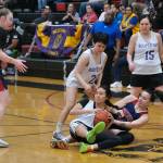 Hooper Bays Ernie Joe and Yakutats Lorena Williams battle for a loose ball Friday during Hooper Bays 60-58 Womens Bracket elimination game win over Yakutat at the 76th Annual Juneau Lions Club Gold Medal Basketball Tournament in Juneau-Douglas High School: Yadaa.at Kalés George Houston Gymnasium. (Klas Stolpe / Juneau Empire)