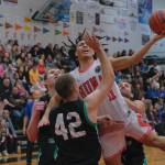Hoonahs Kayden Lamebull-Ingram (11) is fouled by Haines Kyle Rush (behind) while Tyler Swinton and Kyle Fossman defend during Haines 75-70 B Bracket elimination game win Friday at the 76th Annual Juneau Lions Club Gold Medal Basketball Tournament in Juneau-Douglas High School: Yadaa.at Kalés George Houston Gymnasium. (Klas Stolpe / Juneau Empire)
