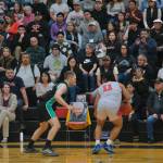 A memorial photo of Harriet Knudson sits in a special chair courtside at Fridays Haines and Hoonah B Bracket game at the 76th Annual Juneau Lions Club Gold Medal Basketball Tournament in Juneau-Douglas High School: Yadaa.at Kalés George Houston Gymnasium. Knudson once said she saw every Gold Medal game since its start in 1946. (Klas Stolpe / Juneau Empire)