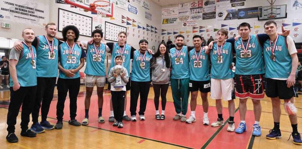 A (Open) Bracket champions Juneau-AML pose for a photo Saturday after winning the 76th Annual Gold Medal Basketball Tournament. (Klas Stolpe / Juneau Empire)