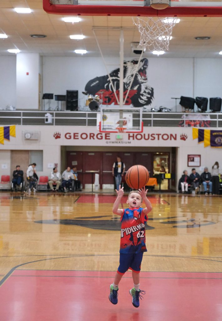 Decklyn Tompkins, 5, practices his shooting touch while waiting to watch his uncle Kaleb Tompkins play at Saturdays Open Bracket of the 76th Annual Gold Medal Basketball Tournament. (Klas Stolpe / Juneau Empire)