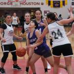 Craigs Vanessa James (23), Liz Thomsen, Tina Steffen (24) and Nani Weimer (10) defend Hooper Bays Ariana Lake (20) during the Womens Bracket Championship on Saturday at the 76th Annual Juneau Lions Club Gold Medal Basketball Tournament in Juneau-Douglas High School: Yadaa.at Kalés George Houston Gymnasium. (Klas Stolpe / Juneau Empire)