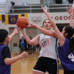 Craigs Tina Steffen (30) shoots over Hooper Bays Susie Long (3) and Mary Long (4) during the Womens Bracket Championship on Saturday at the 76th Annual Juneau Lions Club Gold Medal Basketball Tournament in Juneau-Douglas High School: Yadaa.at Kalés George Houston Gymnasium. (Klas Stolpe / Juneau Empire)