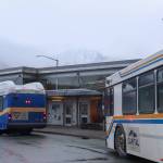A Capital City Transit Center electric bus (left) and diesel bus (right) wait for passengers at the Downtown Transit Center on Friday, March 7, 2025. (Jasz Garrett / Juneau Empire)