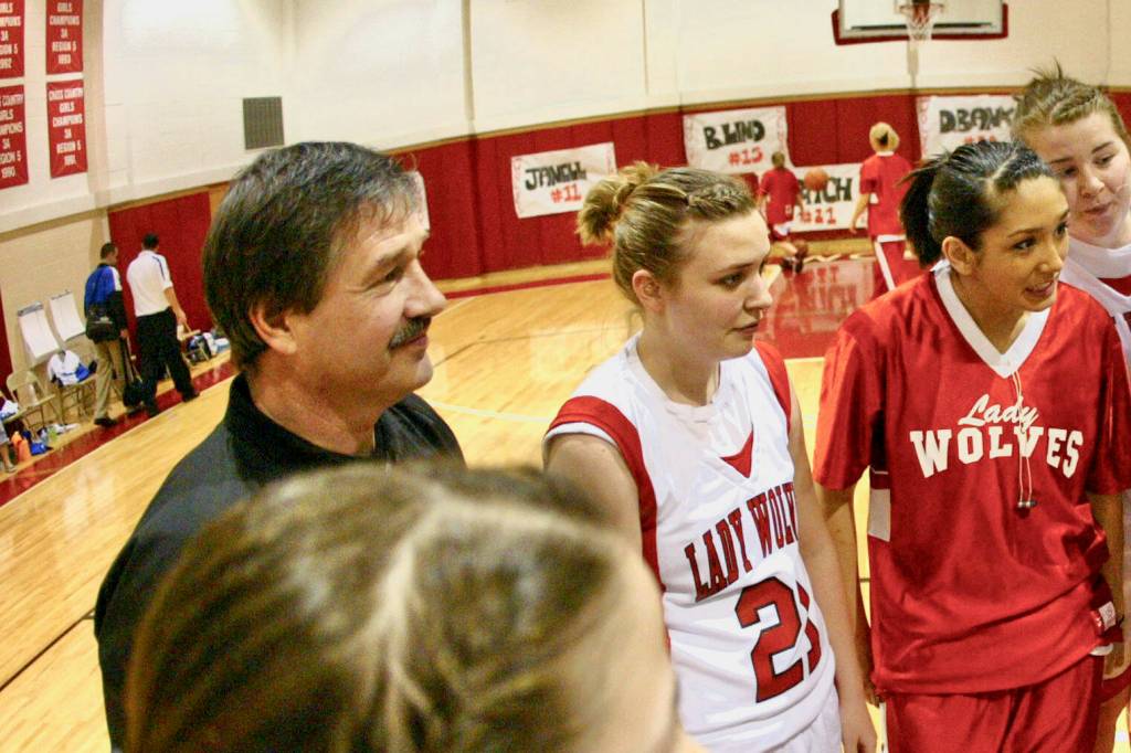 Basketball official Fred Angerman Jr listens during a pregame captains meeting during a homecoming game between Wrangell and Petersburg in 2008. (Klas Stolpe / Juneau Empire)