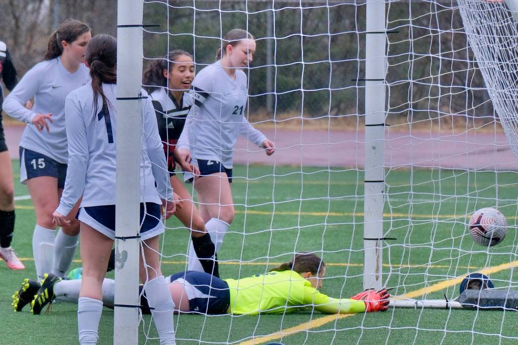 Juneau-Douglas High School: Yadaa.at Kalé freshman Zoe Tagsip watches her shot settle into the back of the Eagle River net during the Crimson Bears 3-0 win over the Wolves on Friday at Adair Kennedy Field. (Klas Stolpe / Juneau Empire)