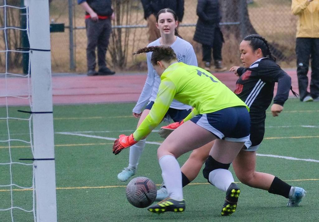 Juneau-Douglas High School: Yadaa.at Kalé senior Milina Mazon hits a left-footed score past the Eagle River keeper during the Crimson Bears 3-0 win over the Wolves on Friday at Adair Kennedy Field. (Klas Stolpe / Juneau Empire)