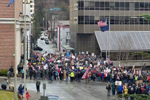 Protesters spill out into the street beyond the front of the Alaska State Capitol on Saturday as part of anti-Trump demonstrations that took place internationally during the day. (Mark Sabbatini / Juneau Empire)