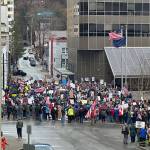 Protesters spill out into the street beyond the front of the Alaska State Capitol on Saturday as part of anti-Trump demonstrations that took place internationally during the day. (Mark Sabbatini / Juneau Empire)