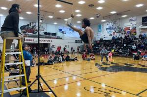 Quentin ODomin attempts a 100-inch two-foot high kick during the Traditional Games on Sunday at Juneau-Douglas High School: Yadaa.at Kalé. (Mark Sabbatini / Juneau Empire)
