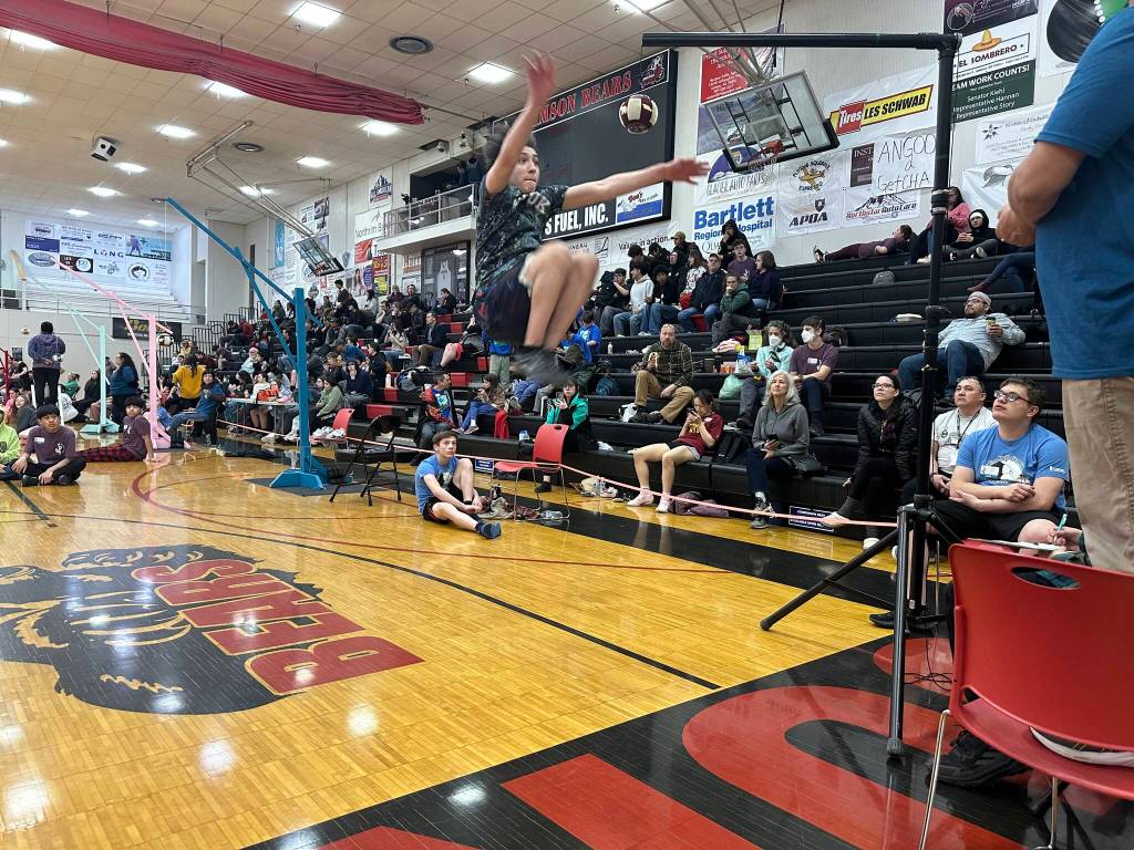 Joseph Rodgers, 12, a member of Chickaloons middle school team, attempts a two-foot high kick during the Traditional Games on Sunday at Juneau-Douglas High School: Yadaa.at Kalé. (Mark Sabbatini / Juneau Empire)