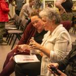 Assembly member Alicia Hughes-Skandijs chats with the vice president of strategic initiatives for Huna Totem, Susan Bell, following the vote on Huna Totems waterfront tideland lease on Monday, April 7, 2025. (Jasz Garrett / Juneau Empire)