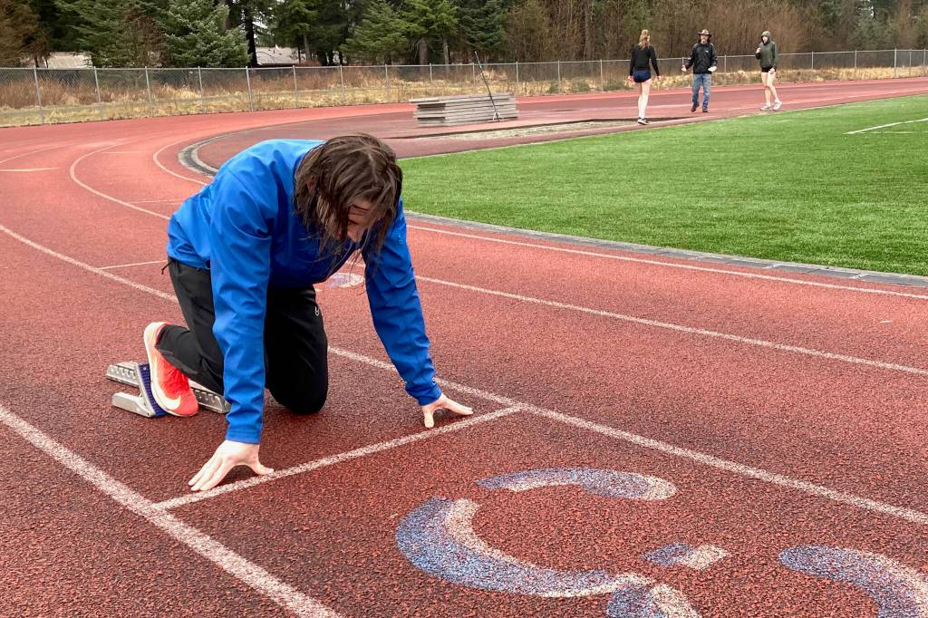 Juneau-Douglas High School: Yadaa.at Kalé senior Finley Hightower practices a start at Thunder Mountain Middle School field. Formerly at TM High School, Hightower is one of many athletes now joining the Crimson Bears as the season opens in Kodiak. (Klas Stolpe / Juneau Empire)