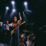 Lucy Nieboer brings an audience member to the stage at the Crystal Saloon in Juneau Tuesday night for an imrpomptu speech about the Haines Pool. That was during the set of relevantly-named Keep the Pool Open (Will Steinfeld/Chilkat Valley News)