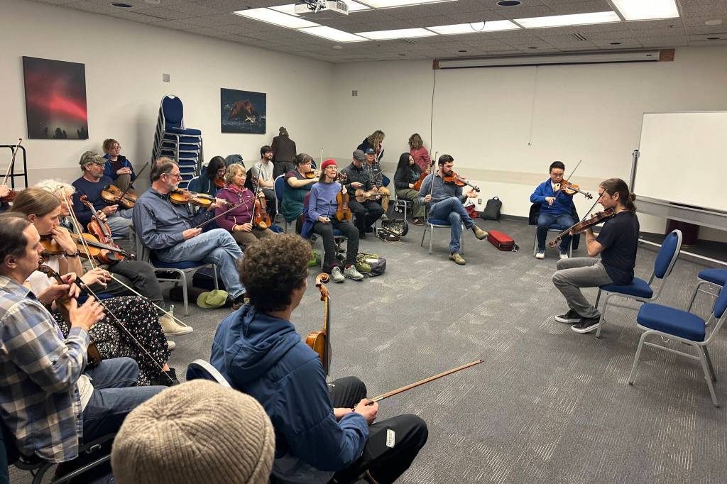 Carter Bancroft leads a fiddle workshop Saturday afternoon at Centennial Hall as part of the weeklong 50th Alaska Folk Festival. (Mark Sabbatini / Juneau Empire)