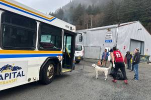 People and one of their pets depart the citys cold-weather emergency shelter in Thane on Wednesday morning, the last day it is scheduled to be open until October. (Mark Sabbatini / Juneau Empire)