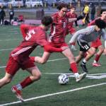 JDHS junior Jesper Bennetsen (8) clears a ball past West Valley senior Diego Guevara (11) as JDHS freshman Bryce Haygood (15) and senior Kellen Chester react during the Crimson Bears 1-0 win over the Wolfpack on Friday at Adair Kennedy Park. The teams play again at noon Saturday. (Klas Stolpe / Juneau Empire).