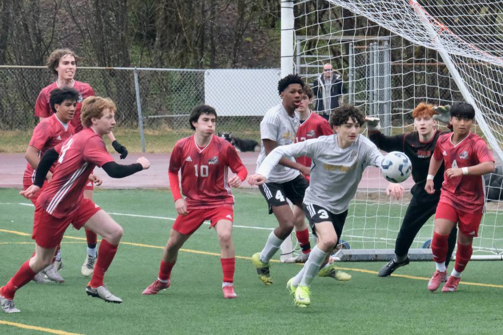 Juneau-Douglas High School: Yadaa.at Kalé players defend their goal against West Valley during the Crimson Bears 4-1 win over the Wolfpack on Saturday at Adair Kennedy Park. (Klas Stolpe / Juneau Empire).