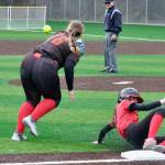 Juneau-Douglas High School: Yadaa.at Kalé senior Tatum Billings slides safely past West Valley third baseman Makayla Anderson (76) during the Crimson Bears 12-6 win over the Wolfpack on Saturday at Adair Kennedy Park. (Klas Stolpe / Juneau Empire).